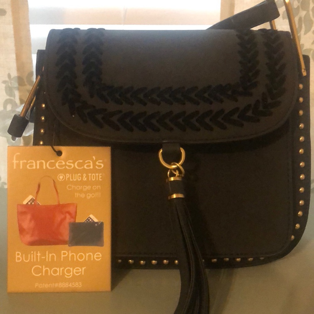 Black handbag with built in phone charger